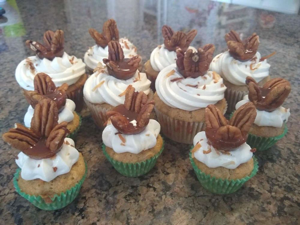 Hummingbird Cupcakes with Cream Cheese-Maple Frosting and Praline Topper