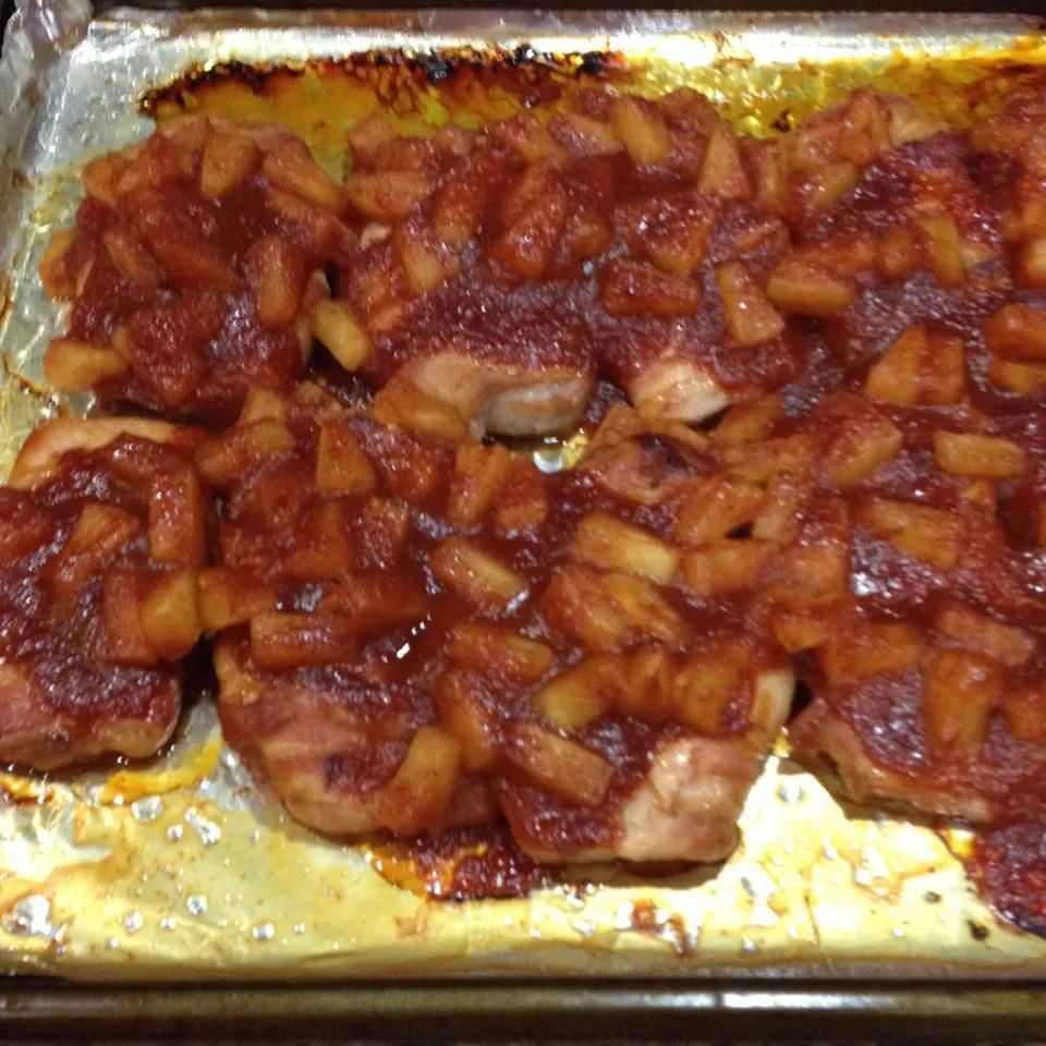 Bacon Wrapped Pork Chops in Zesty Sauce