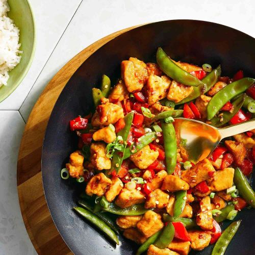 Szechuan Chicken, Peppers, and Peas on Rice